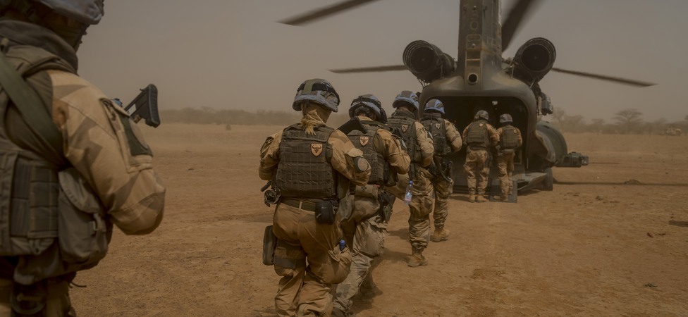 Soldiers entering a helicopter