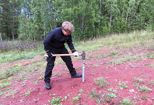 man taking soilsample